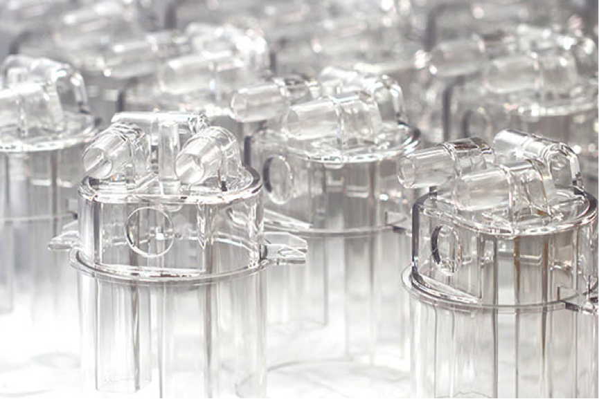 Clear plastic water reservoirs made at Michigan CNC Machining Parts, Inc. for Marco Beverage