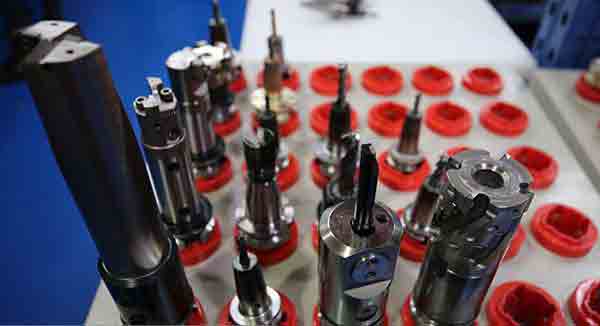 CNC mill cutters mounted on tool holders at Michigan CNC Machining Parts, Inc.