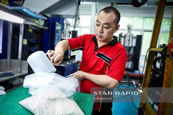 Mixing plastic pellets at Michigan CNC Machining Parts, Inc.