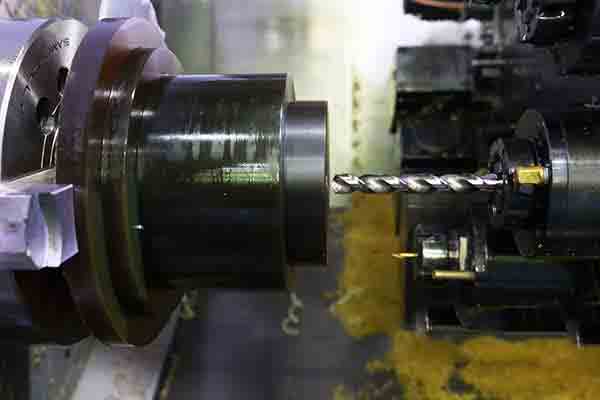 Ultem billet being CNC milled at Michigan CNC Machining Parts, Inc.