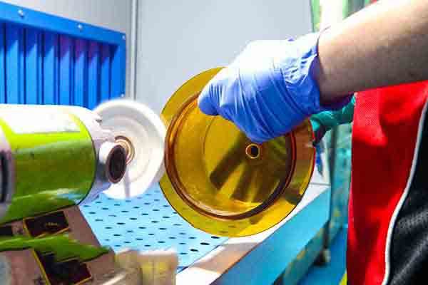 Buffing plastic at Michigan CNC Machining Parts, Inc.