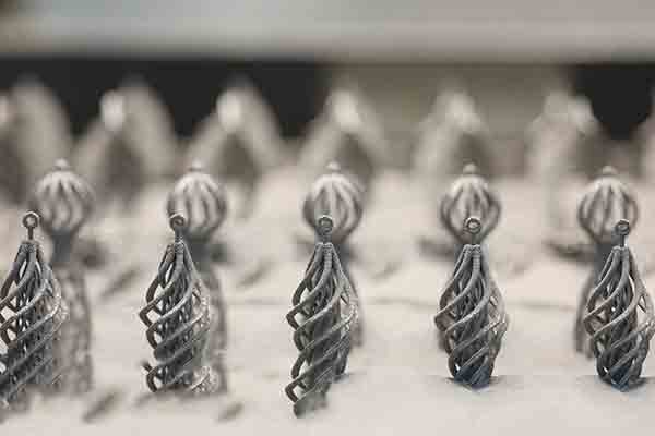 Close-up of V. Nunes 3D printed spinner earrings